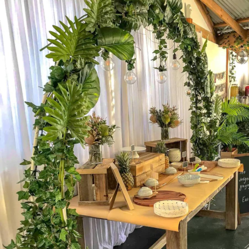 white wire arch with greenery 