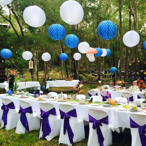 white chair covers with purple sashes 