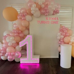 light up 1 at a first birthday photo backdrop