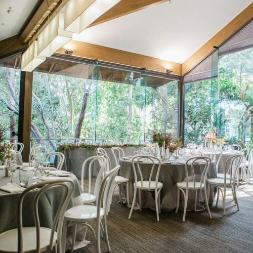 round table with white bentwood chairs wedding