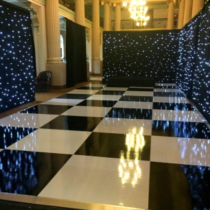 black and white dancefloor with starlight drape