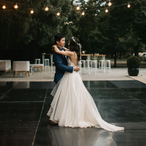 black outdoor dancefloor with married couple