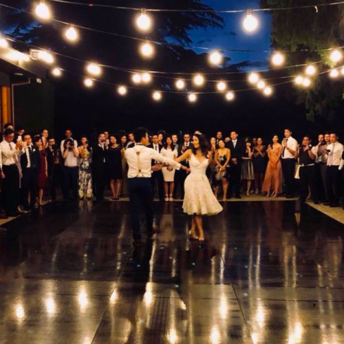 black dancefloor with couple dancing