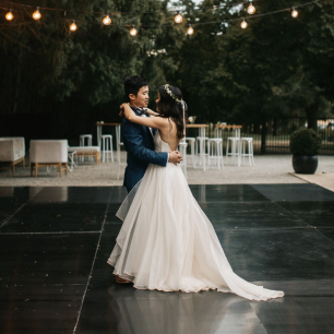 black outdoor dancefloor with married couple