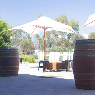 market umbrella wine barrels rustic outdoor party