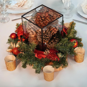 table christmas centrepiece with pinecones and candles