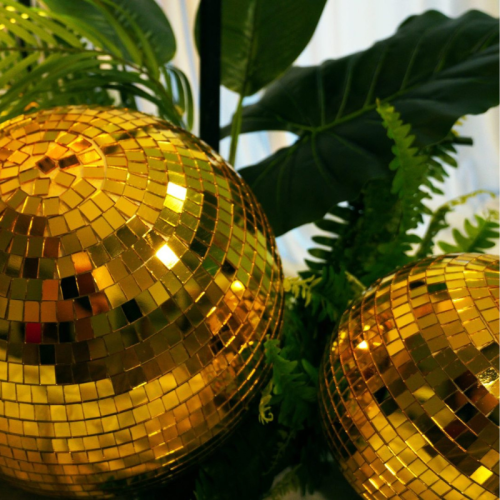 golden tropical disco balls close up