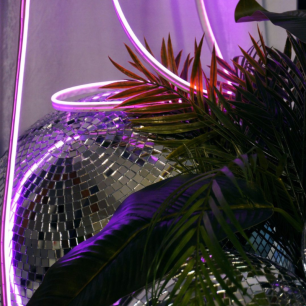 neon strip lighting mirror ball close up