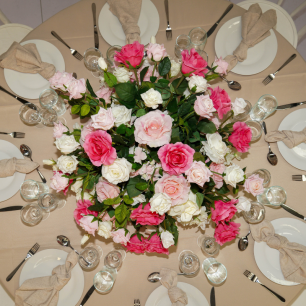 top view of floral centrepiece in centre of wedding table