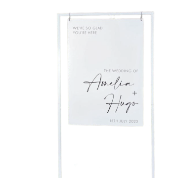welcome sign hanging from white frame