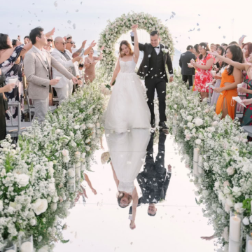 mirrored wedding aisle with bride and groom