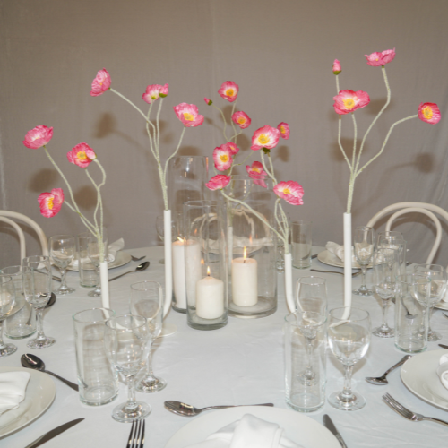 pink small poppy florals in curved vases