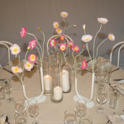 candles and floral vases with poppies