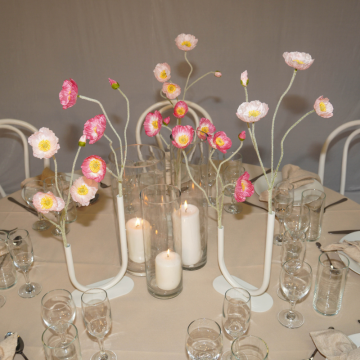 candles and floral vases with poppies