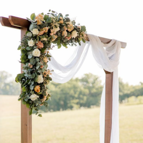 wedding ceremony arch with subtle florals 