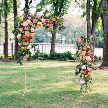 wedding arch with bright florals 