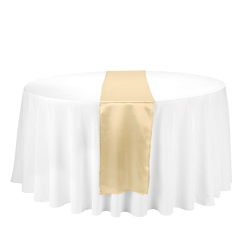 gold satin table runner on round white table cloth