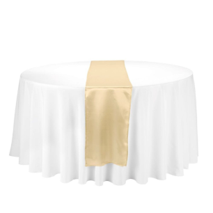 gold satin table runner on round white table cloth