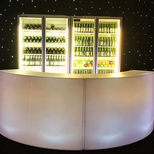 illuminated curved bar with bar fridge