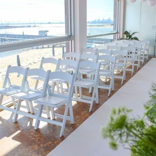 padded chairs beach out the adjacent window