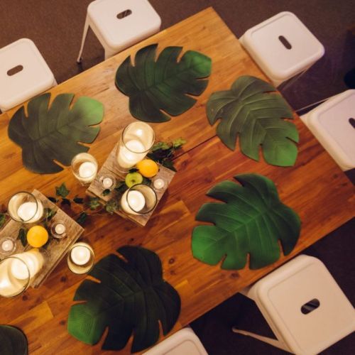 Overhead photo of low lying coffee table and white small bar stools