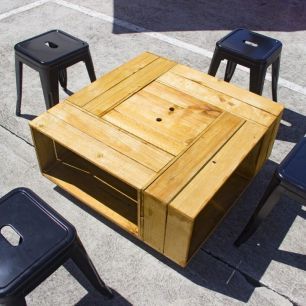 small bar stools around wooden coffee tables 