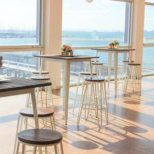 wedding with tolix bar tables and white hairpin stools