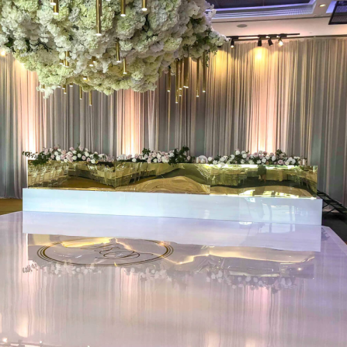 white dancefloor with beige draping